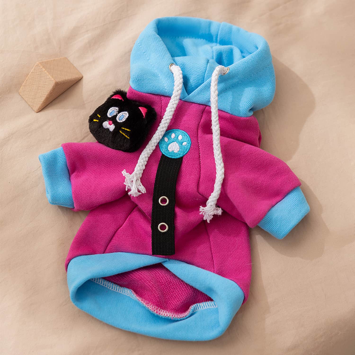 Pink and blue color-blocked dog hoodie with plush cat toy