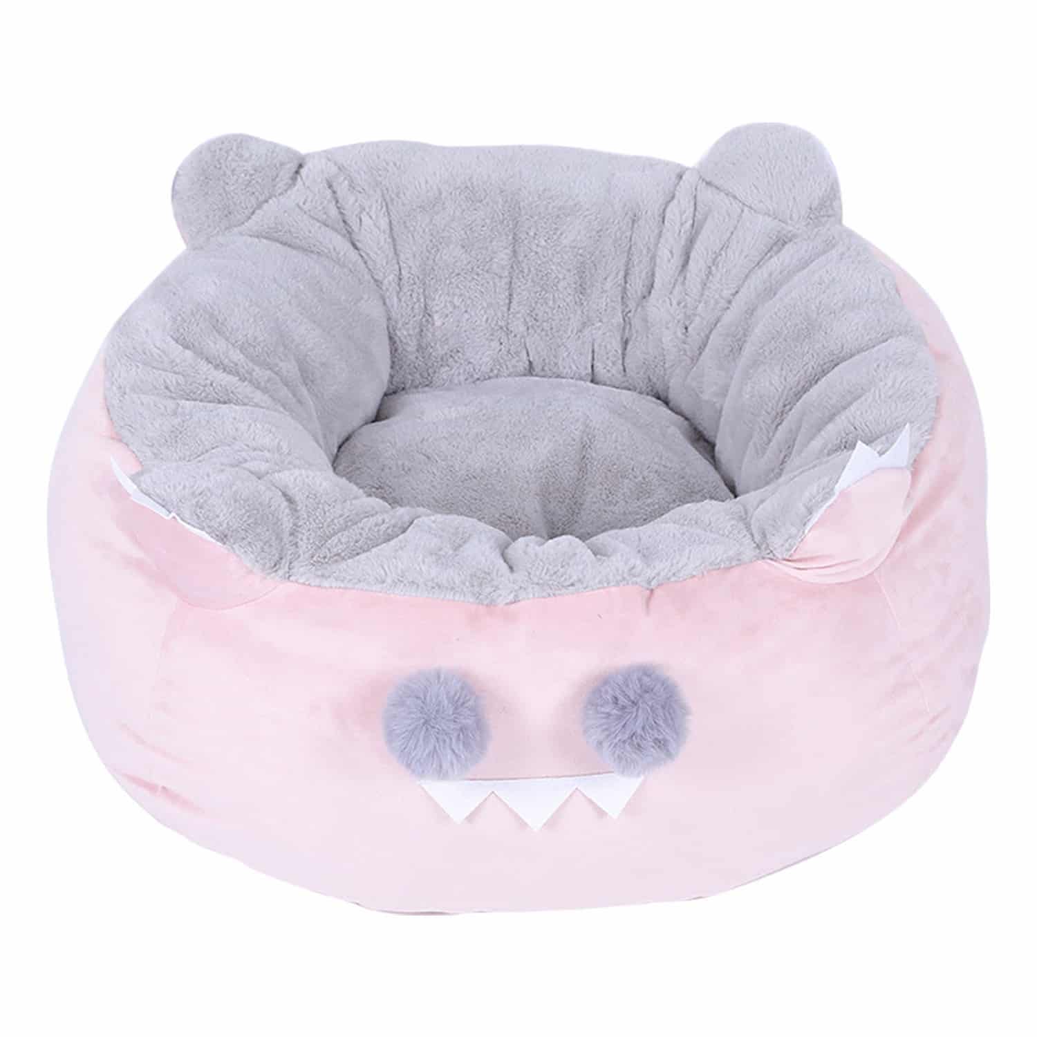 Pink monster-shaped pet bed with gray fur lining