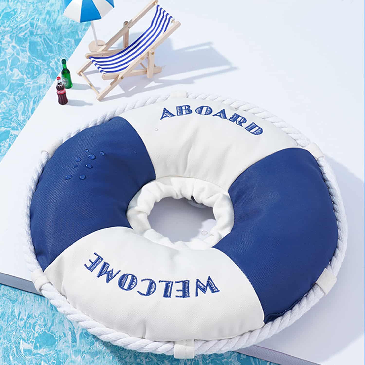 Nautical lifebuoy shaped cat recovery collar with rope trim and embroidered Welcome Aboard text, worn by white cat