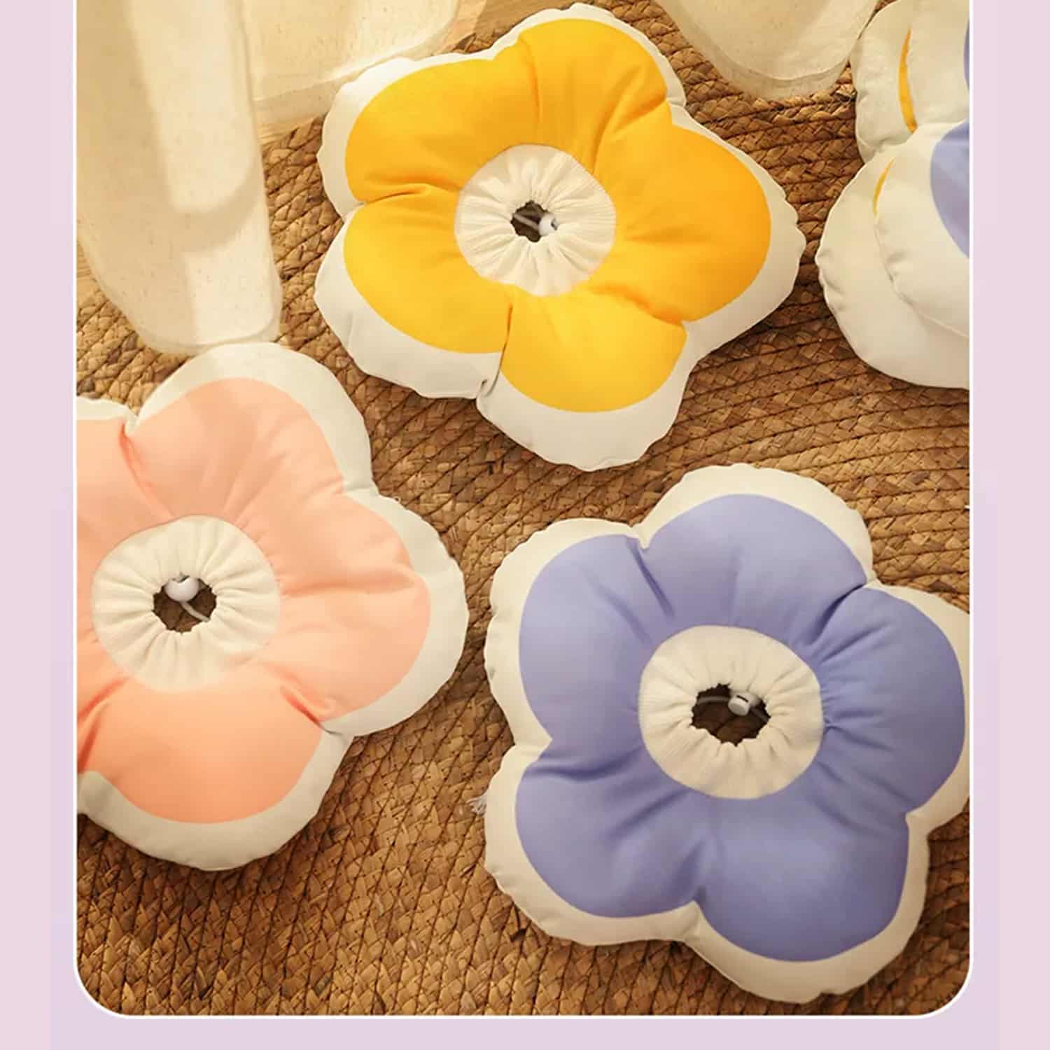 Flower petal shaped cat recovery collar in lavender cotton, cat sleeping with head resting on the collar petals