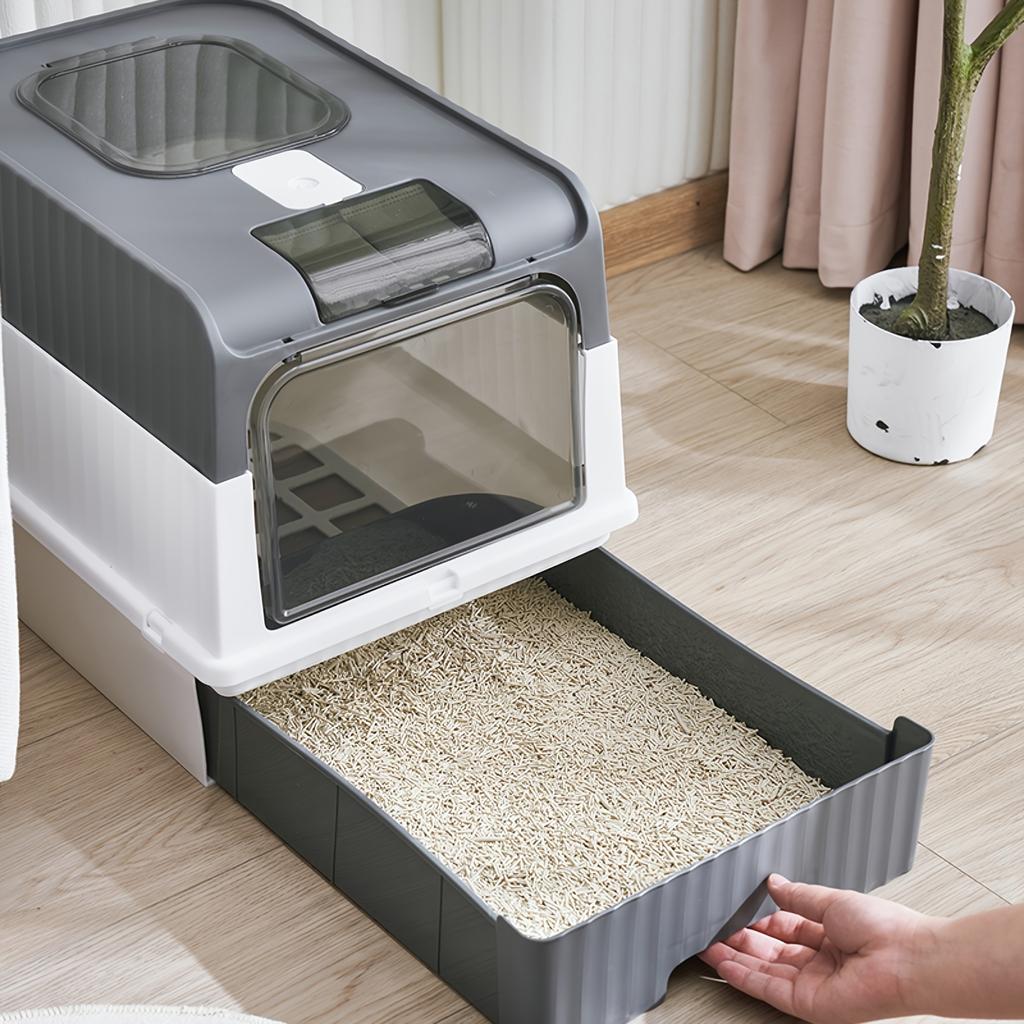Black and white enclosed cat litter box with drawer
