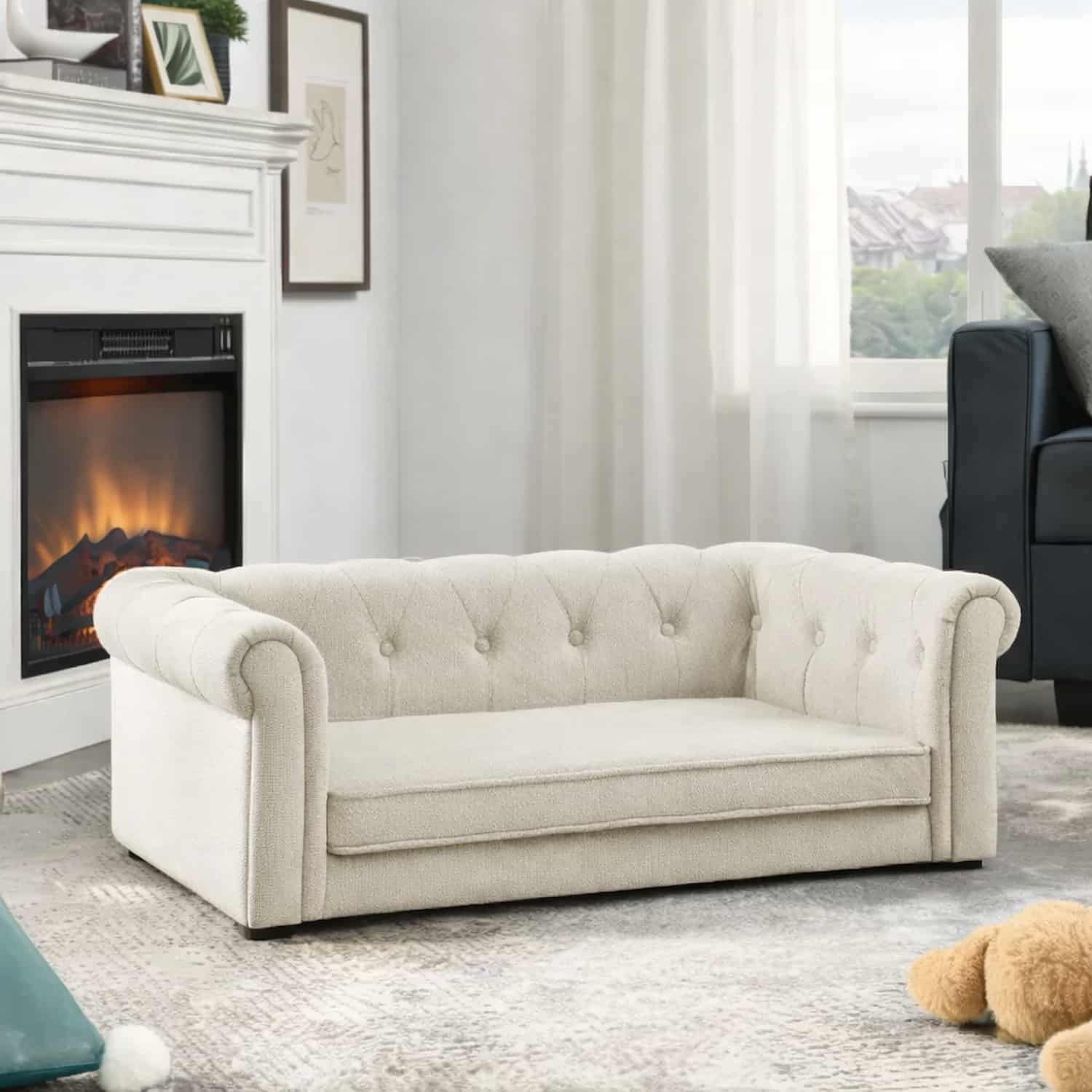 Beige upholstered dog sofa with tufted back and rolled arms